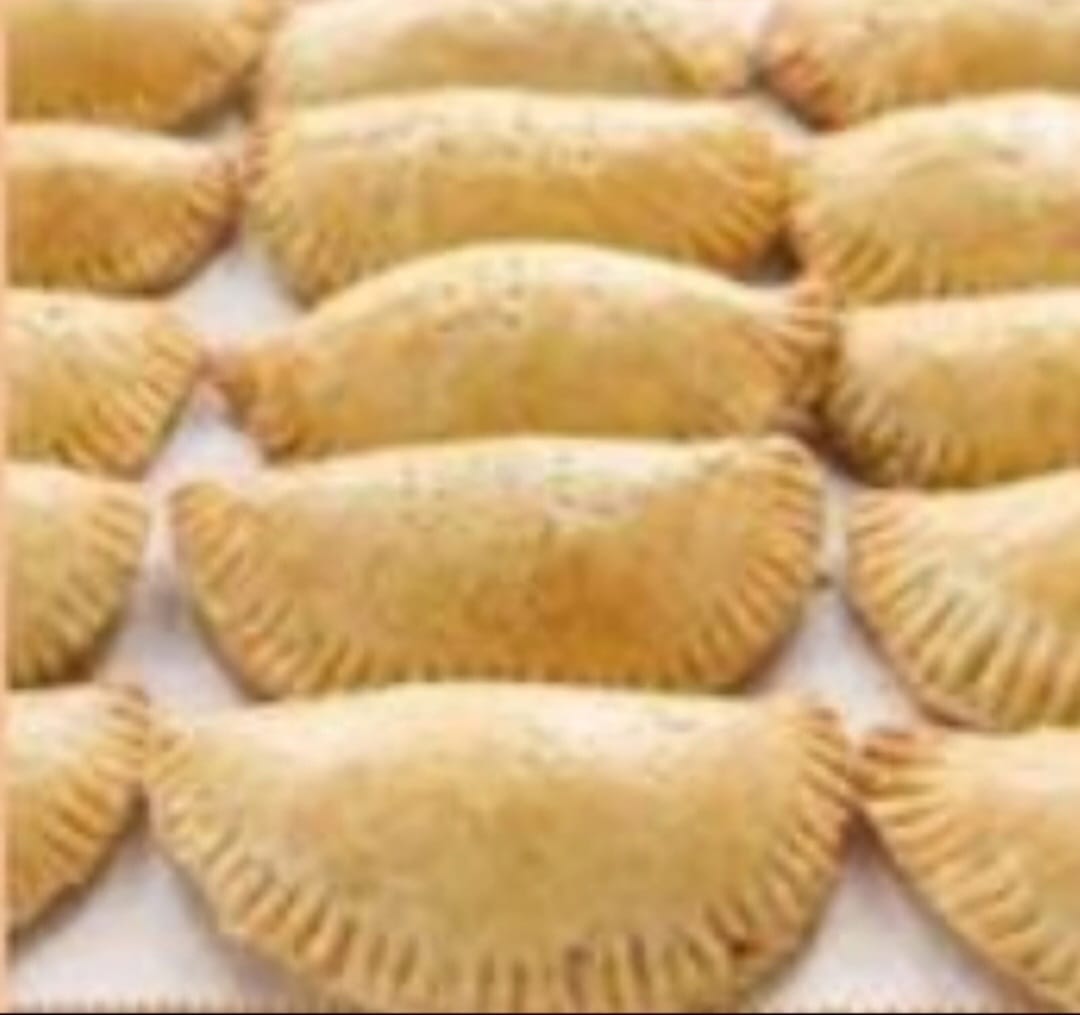 Tray of golden baked Nigerian meat pies